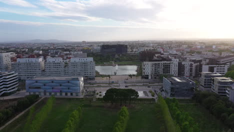 City-park-Port-Marianne-district-Montpellier-aerial-shot-trees-and-town-hall.